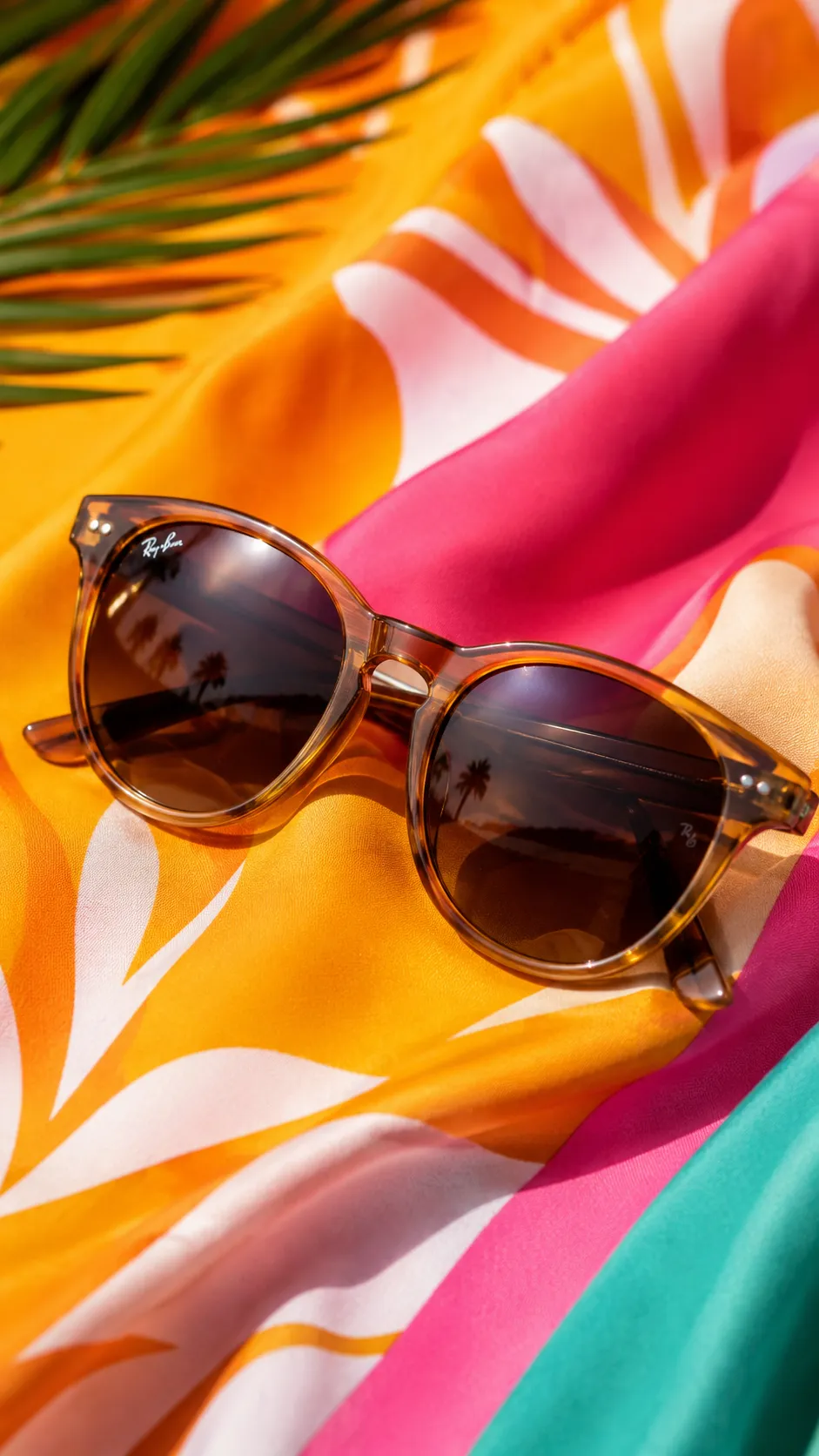 Sunglasses Resting on Colorful Fabric Background